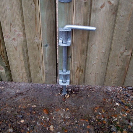 Drop bolt with drop bolt tube installed on a gate